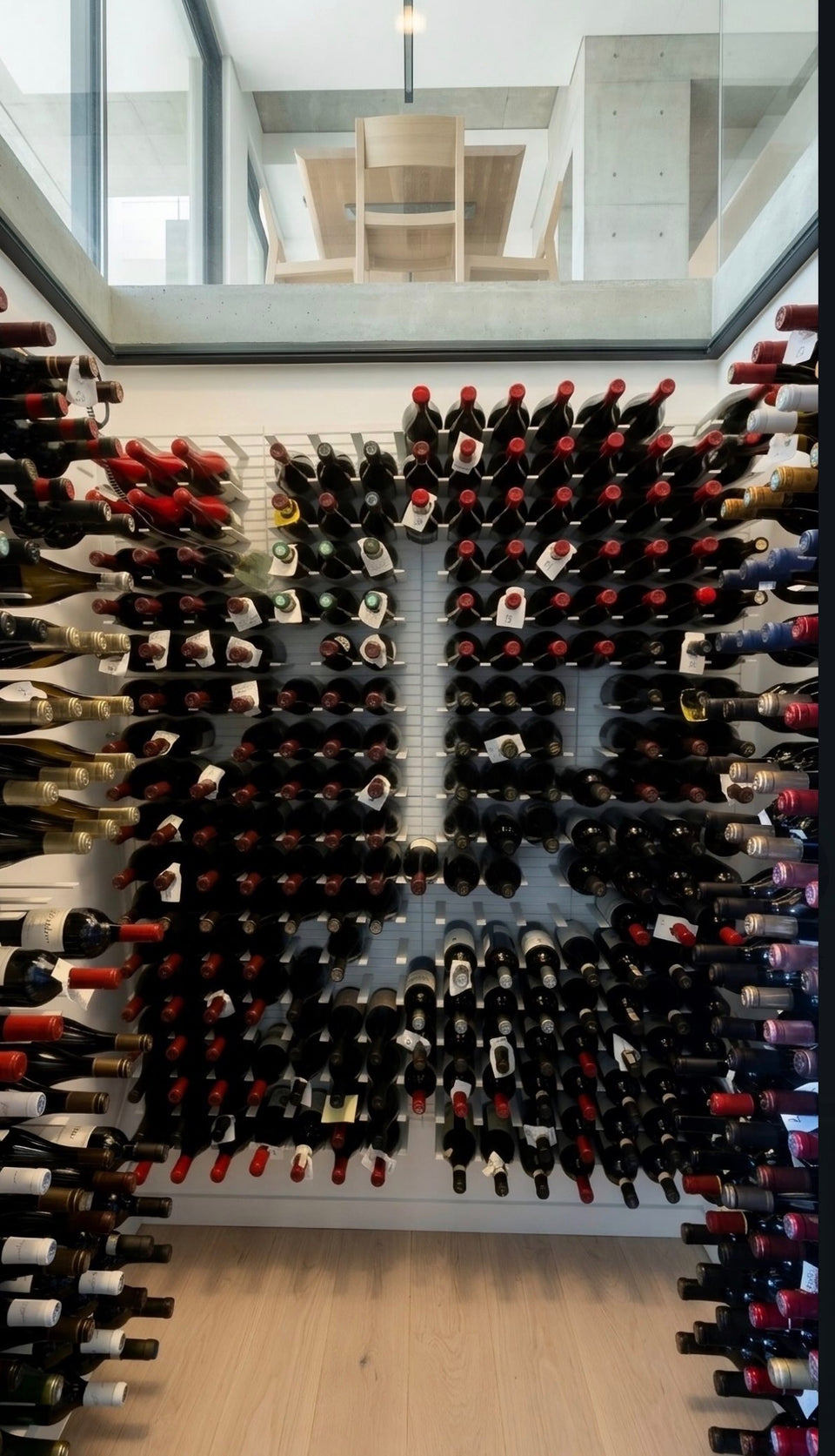 A modern underground wine cellar with glass ceiling.