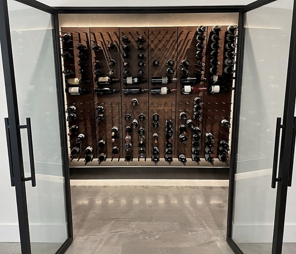 walk in wine cellar with walnut and black stact wine racks