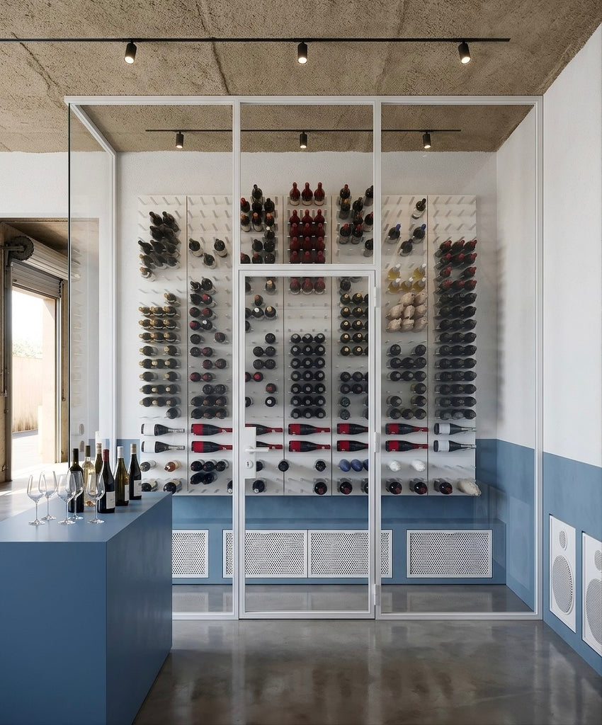 Modern wine cellar in a tasting room finished in white and silver.