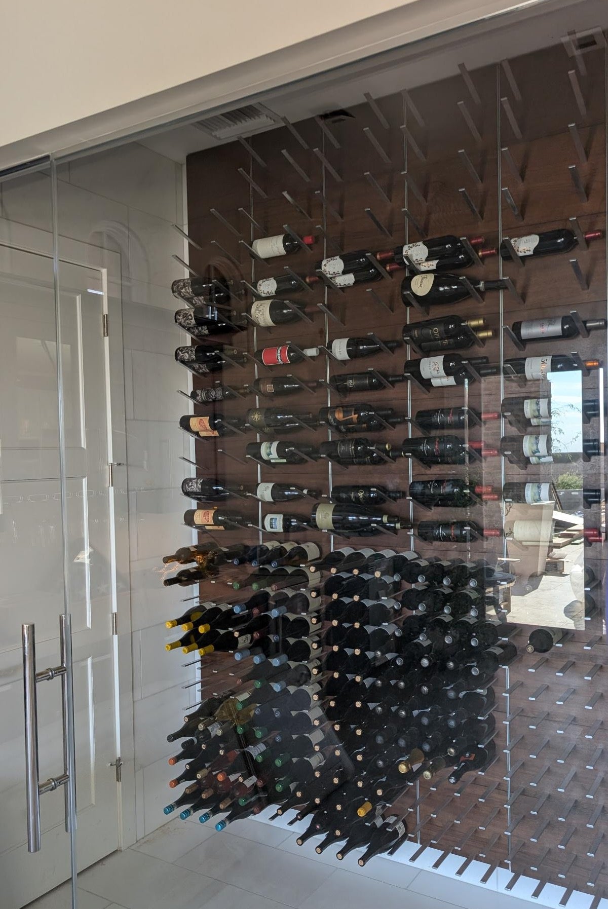Contemporary wine room featuring STACT Premier Walnut & Silver wall-mounted wine racks.