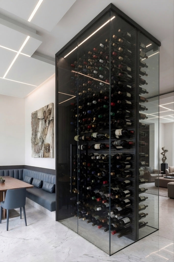 Floor-to-ceiling glass wine cellar room divider with black STACT wine racks, smoked glass panels, marble flooring, and integrated ceiling lighting in a modern luxury home.