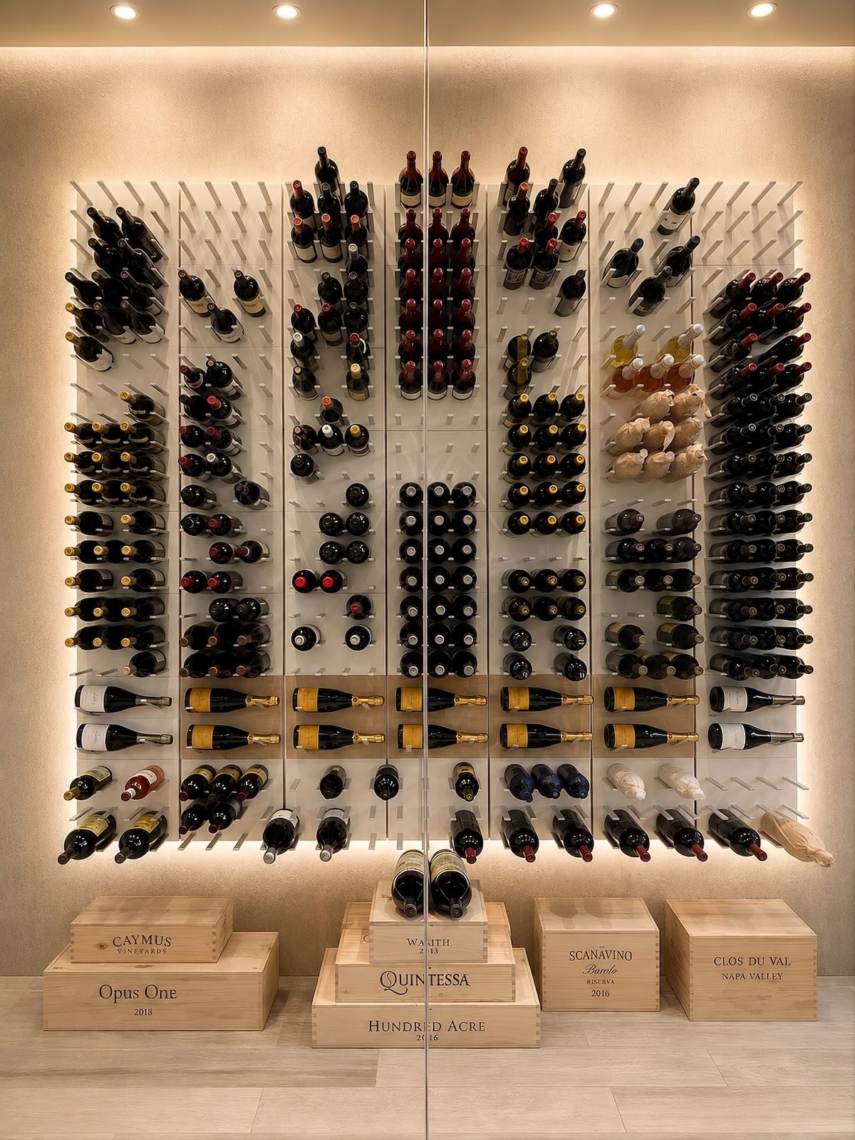Glass-enclosed white wine cellar with rift-cut oak and a backlit STACT Premier Oak & Silver wine display.