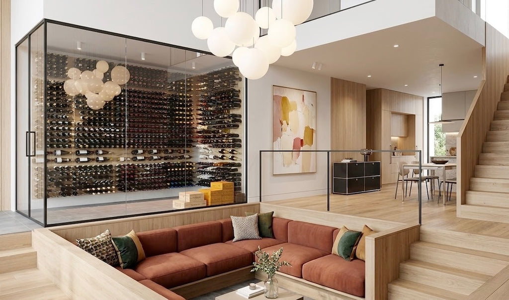 Open-plan modern home with a large glass wine room, floor-to-ceiling bottle storage, light wood finishes, and a sunken lounge seating area.