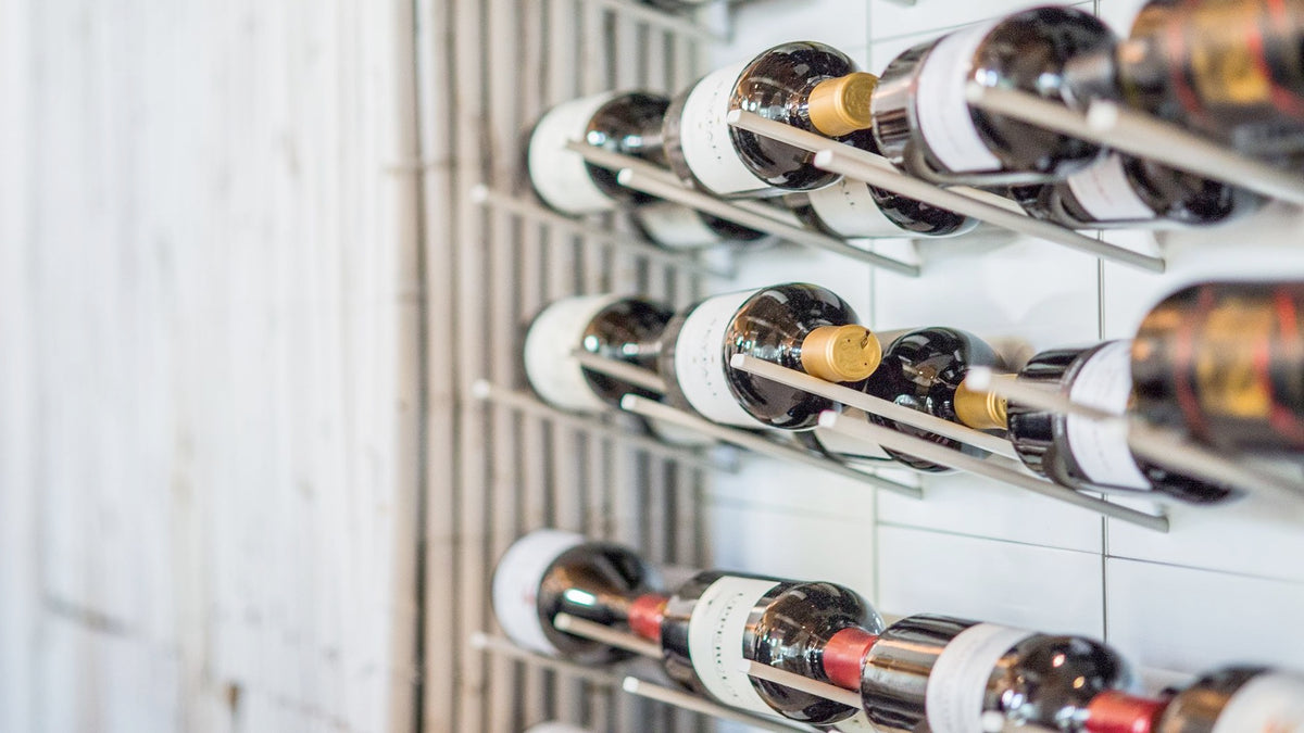 Minimalist STACT Premier White & Silver label-forward wine wall.
