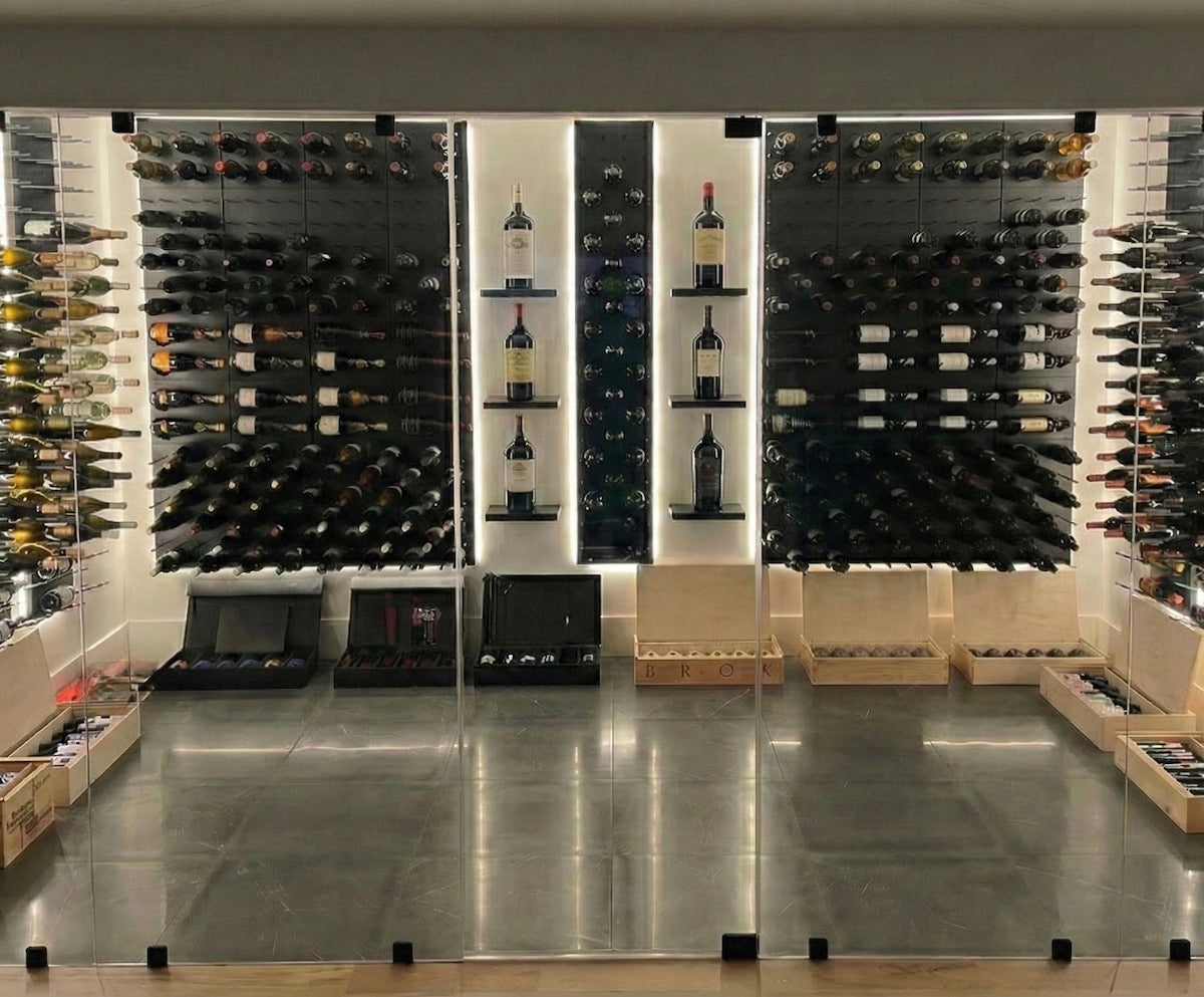Large STACT Premier BlackOut wine cellar composition with bottle storage, shelves and finished open panel areas.