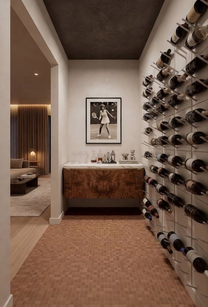 Modern home wine bar with STACT silver wall-mounted wine racks, warm tile flooring, and a built-in tasting counter.