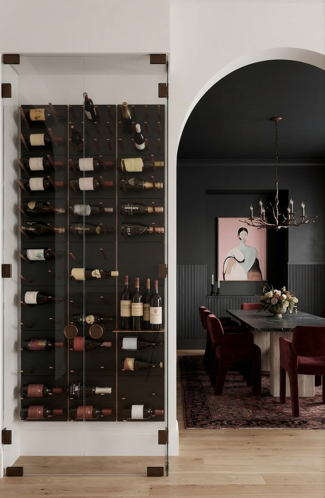 STACT Premier modular wine wall with black panels and bronze hardware in a glass-enclosed modern dining room.