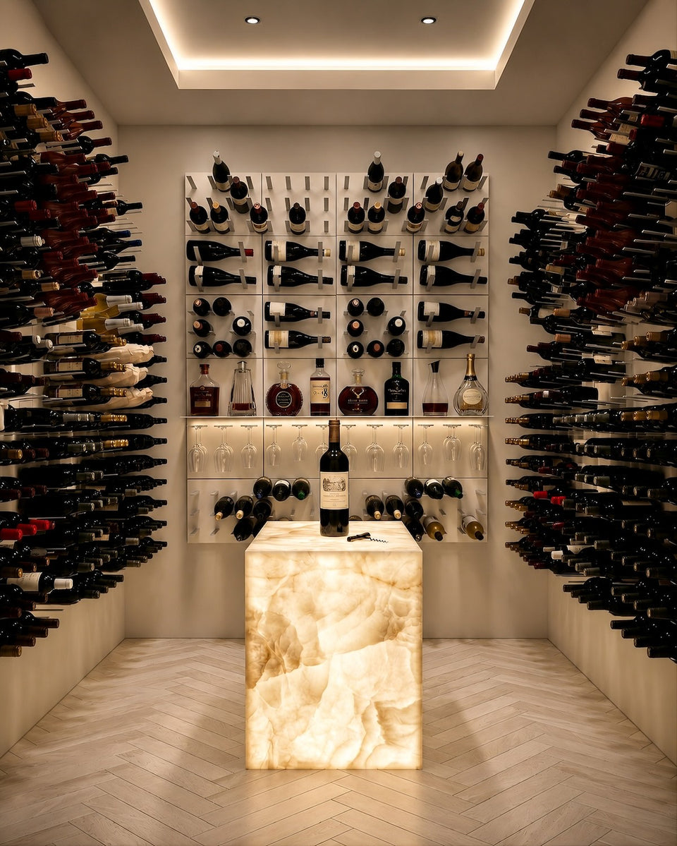 Luxury high-capacity wine room with STACT modular bottle displays, integrated stemware and spirits storage, and an illuminated onyx tasting pedestal.