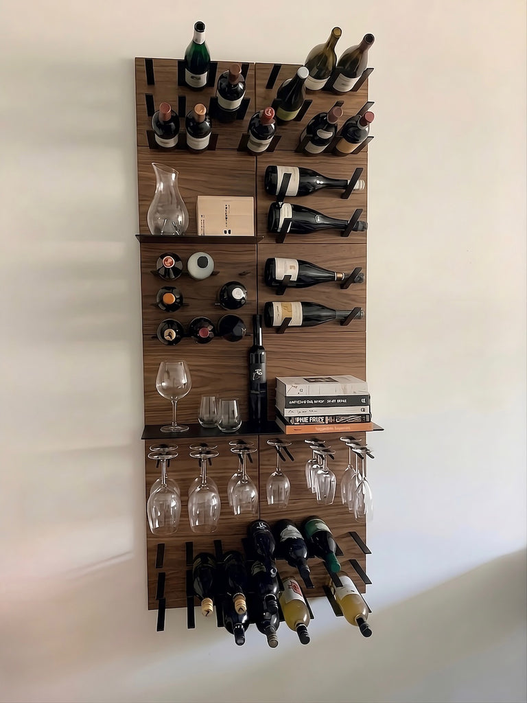 Wooden wall-mounted wine rack with bottles, glasses, and books on a white background