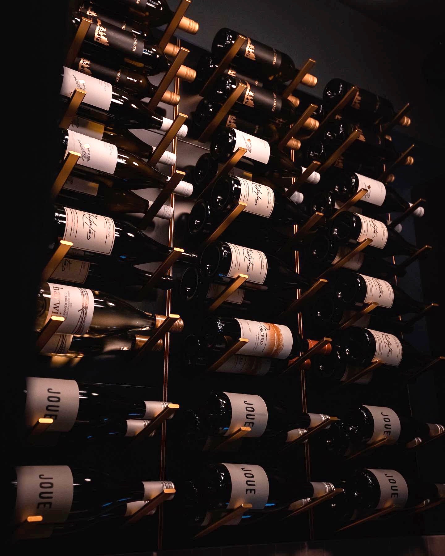STACT Premier Black & Gold wine wall in a refined interior.