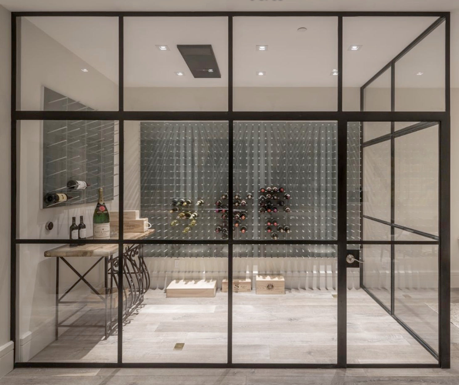 Framed glass wine cellar with STACT Premier Gunmetal Gray & Silver C-type wine racks.