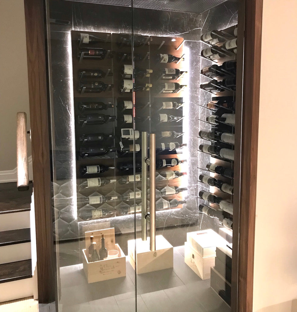 label-out wine display racking in glass-enclosed wine cellar